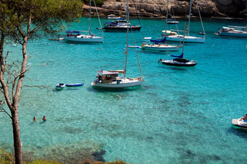 Obraz premium Cala Trebaluger, Menorca / Spain - June 22, 2016: Cala Trebaluger bay, Migjorn Gran, Menorca, Balearic Islands, Spain