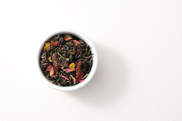Green tea with healing berries and dried fruits. Green tea with fruit. Top view, white background, isolated