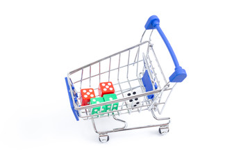 shopping cart with dice on a white background. isolate