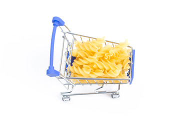 shopping cart with swirled pasta on a white background. isolate