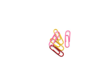 Colored paper clips on white background