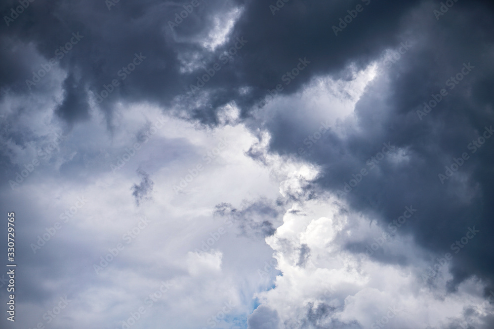 Wall mural terrible thunderclouds from the side of a plane. gloomy epic clouds. background image in a dark gray