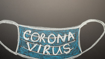 A drawn mask on a blackboard with the inscription Coronavirus. News headline, articles. Epidemic and pandemic, problems in medetsine, lack of masks, with space for inscription, banner.