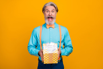Is it for me. Photo of funky crazy grey haired grandpa hold big giftbox birthday surprise amazed...