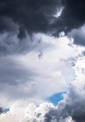 Terrible thunderclouds from the side of a plane. Gloomy epic clouds. Background image in a dark gray style.