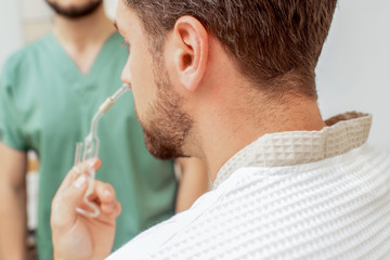 Nasal inhalation in nose.