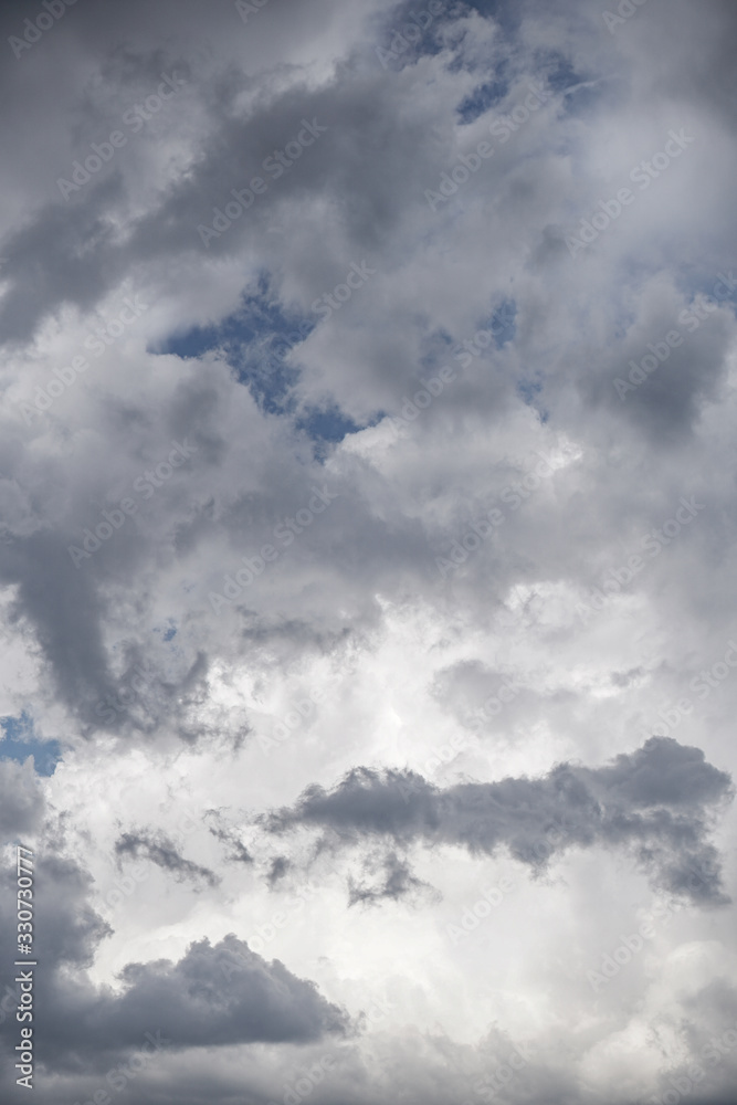 Wall mural terrible thunderclouds from the side of a plane. gloomy epic clouds. background image in a dark gray