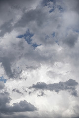 Terrible thunderclouds from the side of a plane. Gloomy epic clouds. Background image in a dark gray style.