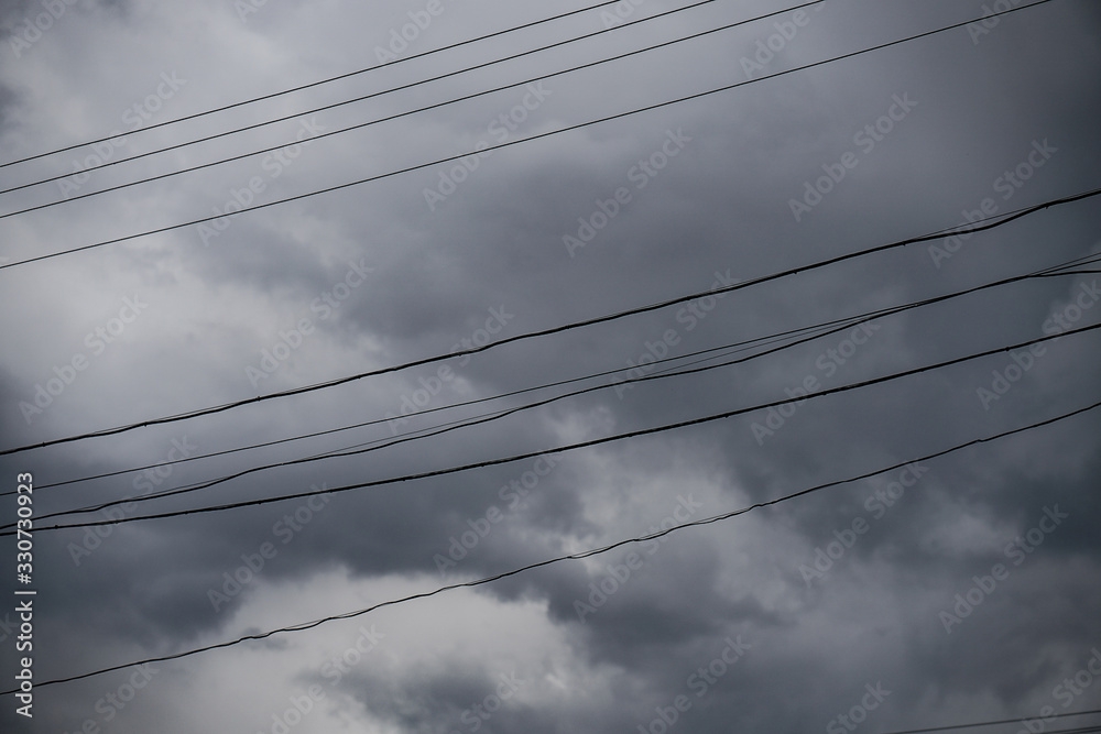 Wall mural terrible thunderclouds from the side of a plane. gloomy epic clouds. background image in a dark gray