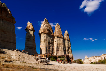 Stone pillars in the Love valley in in Goreme national park. Goreme village, Anatolia, Turkey, Asia.