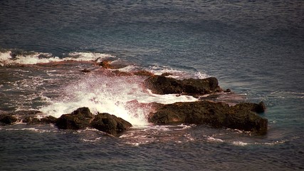 waves hitting rocks