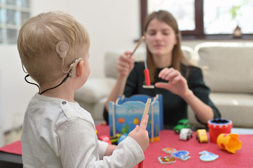 A Boy With A Hearing Aids And Cochlear Implants - 330732507