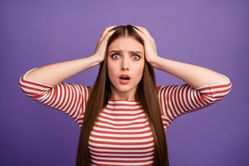 Oh no. Closeup photo of attractive lady long hairdo open mouth listen bad terrible unexpected news arms on head wear casual striped shirt isolated pastel purple color background