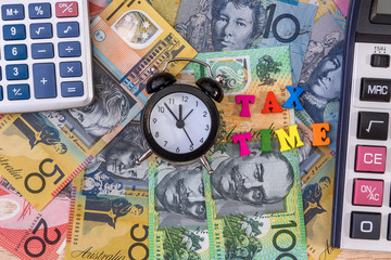 Australian dollars with clock and 'tax time' text