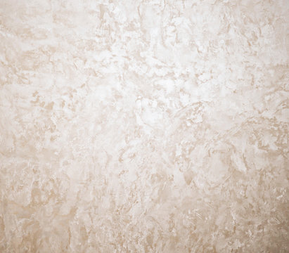 Abstract grunge background. Vintage wall texture. Beige light warm trani marble stone natural surface for bathroom or kitchen countertop. High resolution photo.