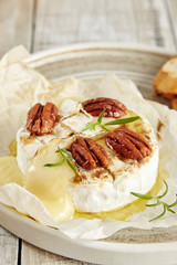 Cream cheese with mold Camembert with honey and nuts
