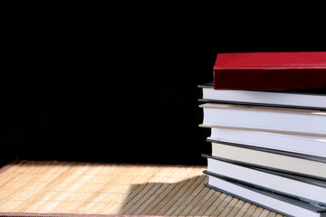 stack of books isolated on a black background
