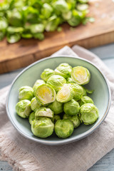 Fresh brusseles sprouts in bowl on kitchen table