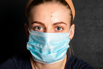 A woman wears a medical mask for protection. Corona virus and Air pollution concept.