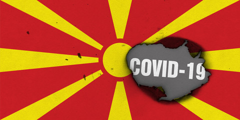 Flag of Macedonia with burned out hole showing Coronavirus name in it. 2019 - 2020 Novel Coronavirus (2019-nCoV) concept, for an outbreak occurs in the Macedonia.