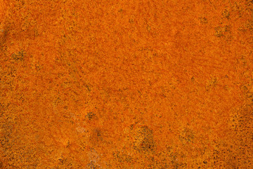 Sample of detail bright orange rust texture on a metal sheet