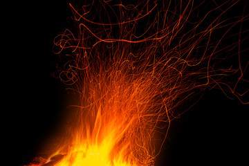 The fire with traces of sparks isolated on black