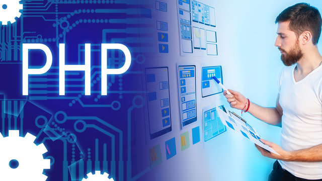 A man looks at web application templates against the background of a PHP label. Creating dynamic websites. PHP scripting language. Hypertext Preprocessor. Interpreted programming language.