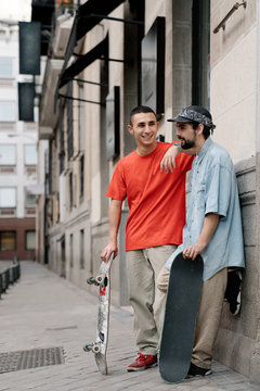 Skaters Having Fun In The City While Having A Conversation