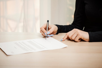 Business woman signing a document