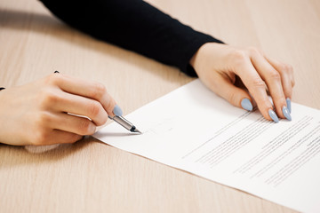 Business woman signing a document