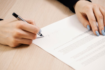 Business woman signing a document