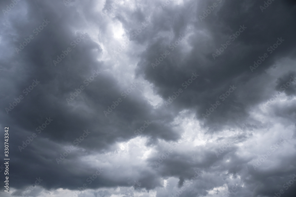Poster terrible thunderclouds from the side of a plane. gloomy epic clouds. background image in a dark gray