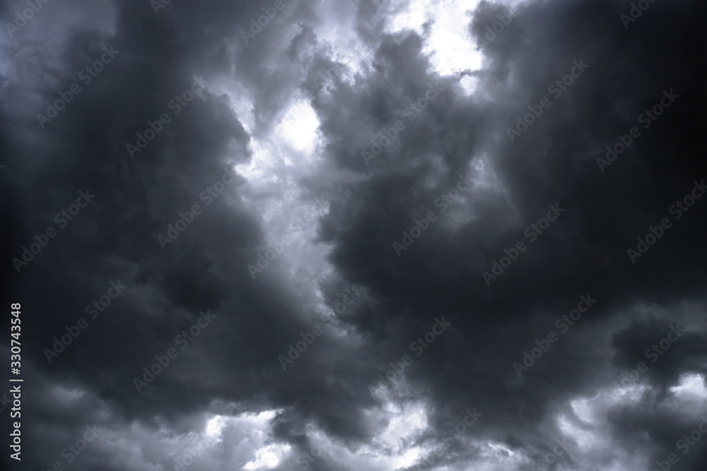 Wall mural terrible thunderclouds from the side of a plane. gloomy epic clouds. background image in a dark gray