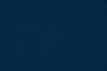 Elegant navy blue colored dark Concrete textured cool grunge abstract background with roughness and irregularities. 2020 color trend concept.