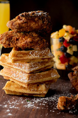 Chicken & waffles. Classic American Diner Style Breakfast or Brunch menu item favorite. Crispy homemade fried chicken on top of home buttermilk waffles topped with butter and maple syrup. 