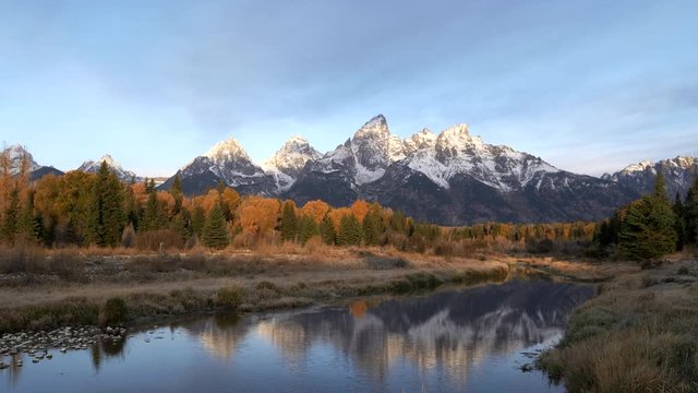 morning zoom in shot of grand teton after an autumn snowstorm from schwabacher landing in grand teton national park of wyoming, usa