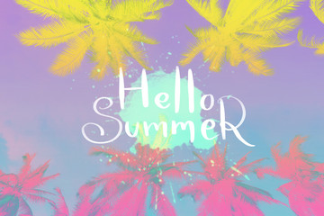 Fototapeta premium Hello summer words on colorful vibrant palm tree abstract background. Summer vacation and travel holiday concept.