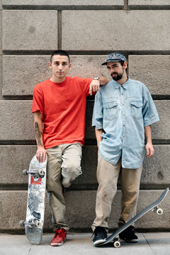 Young Men Skateboarding In The City