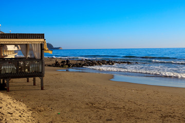 Fototapeta premium Alassio (SV), Italy - February 15, 2017: The Alassio beach, Riviera dei Fiori, Savona, Liguria, Italy.