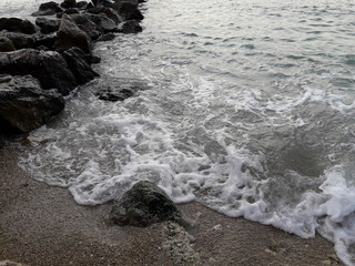Beautiful sea waves with rocks for a wallpaper in Malinska in Croatia.