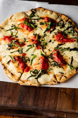 Pizza. Classic traditional Italian entrée favorite. New York Style Pizza with marinara sauce and topped with mozzarella cheese, meats and fresh vegetables. Baked in wood burning oven