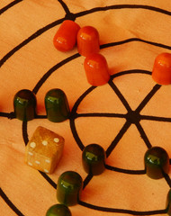 Close up of oriental or Indian or Asian dice based board game for children    