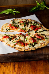 Pizza. Classic traditional Italian entrée favorite. New York Style Pizza with marinara sauce and topped with mozzarella cheese, meats and fresh vegetables. Baked in wood burning oven