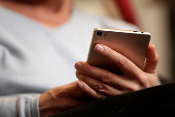 Hands continually touching the telephone keypad