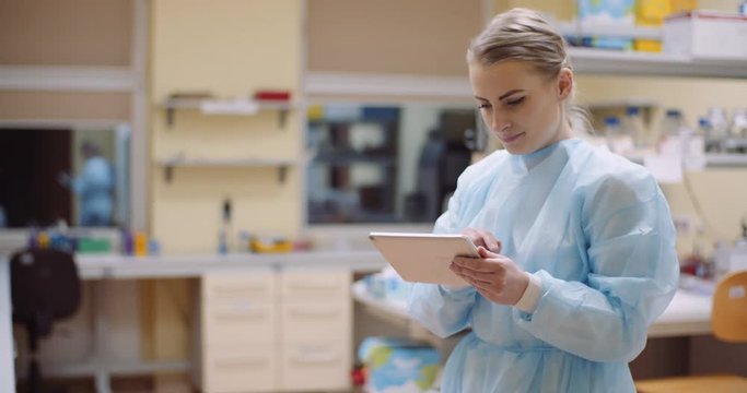 scientist using digital tablet at laboratory