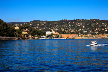 Obraz premium Santa Margherita Ligure (GE), Italy - June 01, 2017: Santa margherita Ligure village view from the boat sailing to Portofino, Genova, Liguria, Italy