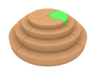 Wooden puzzle construction with a green puzzle piece at the top