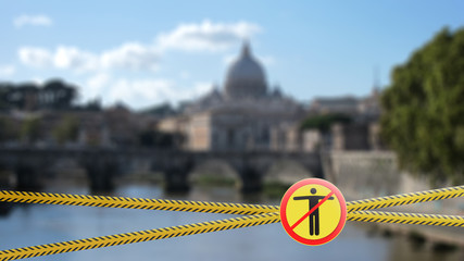 Warning yellow sign with crossed out man on a blurred background of Vatican City in Rome, Italy.
