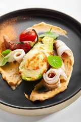 Grilled squid with avocado and egg