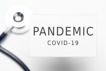 Pandemic COVID-19 text on plastic ID badge
